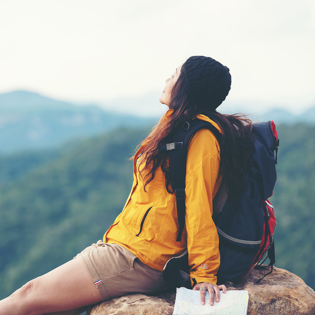 Woman travel  hiker adventure on mountain nature landscape.  Asia lifestyle tourist girl backpack sitting with map to find directions explore and camping outdoors for relax summer time.  